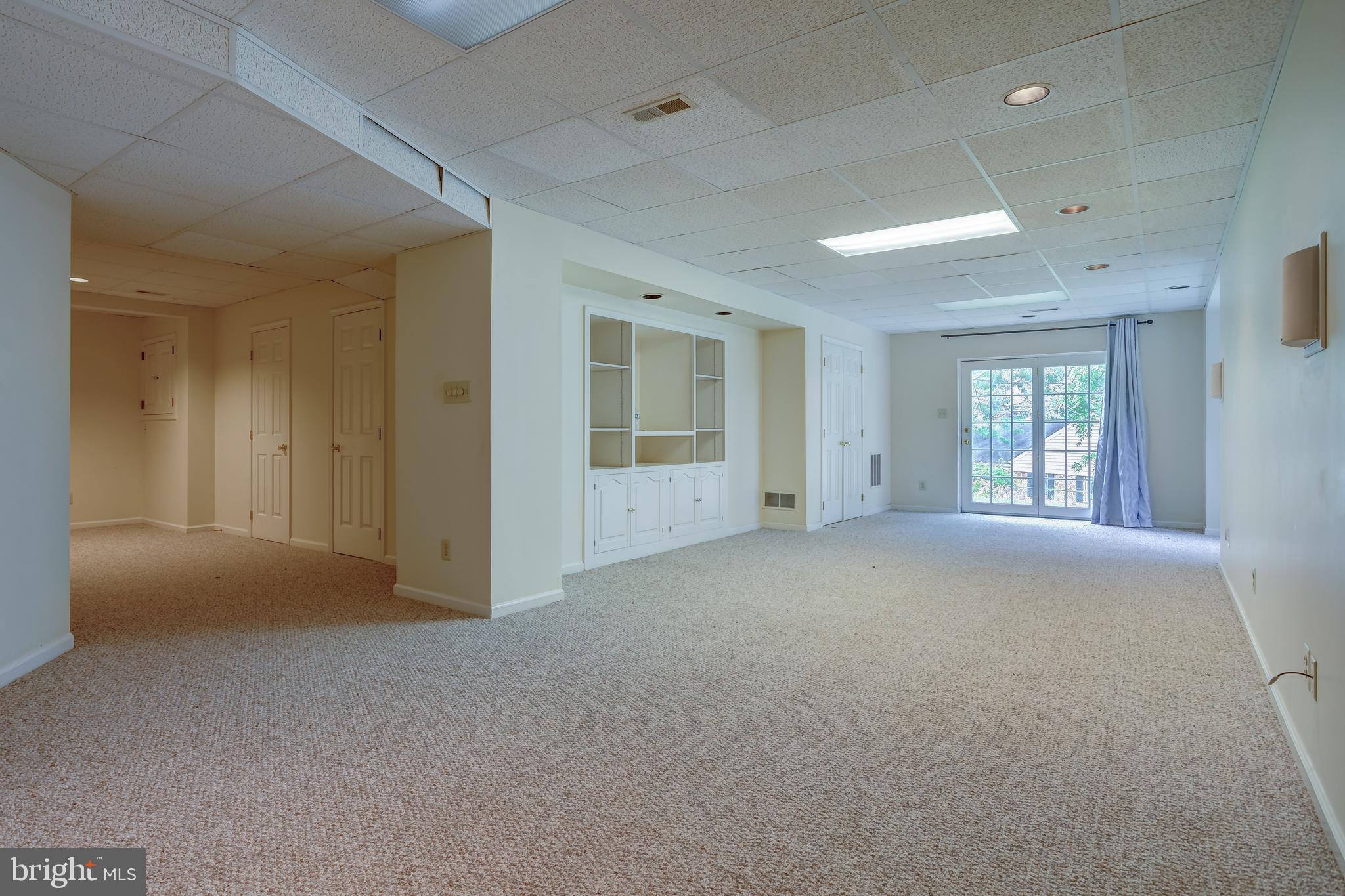 41 Old Covered Bridge Road Newtown Square, PA 19073 - Photo 48 of 58 a view of a big room with windows and chandelier fan