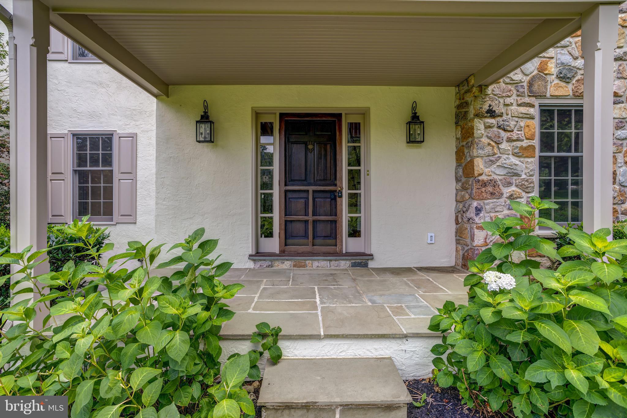 41 Old Covered Bridge Road Newtown Square, PA 19073 - Photo 6 of 58 a front view of a house with a garden