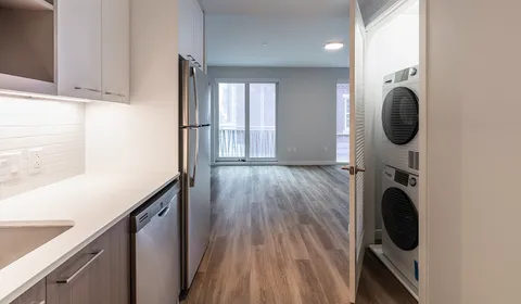 a view of hallway with washer and dryer