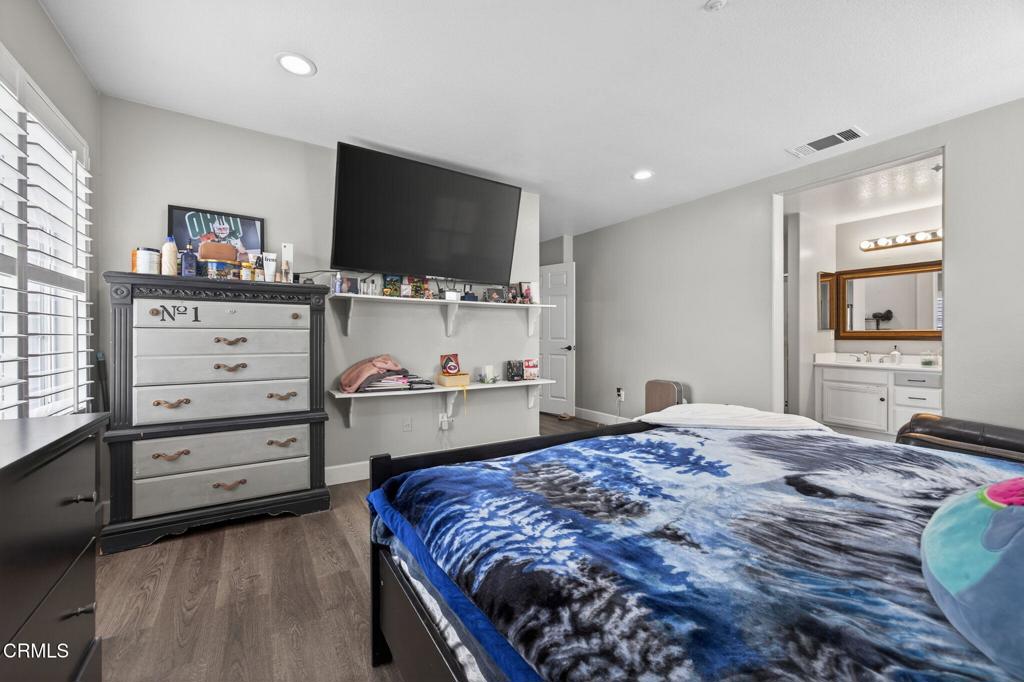 816 Noontide Way Oxnard, CA 93035 - Photo 19 of 41 a bedroom with a bed and a flat screen tv