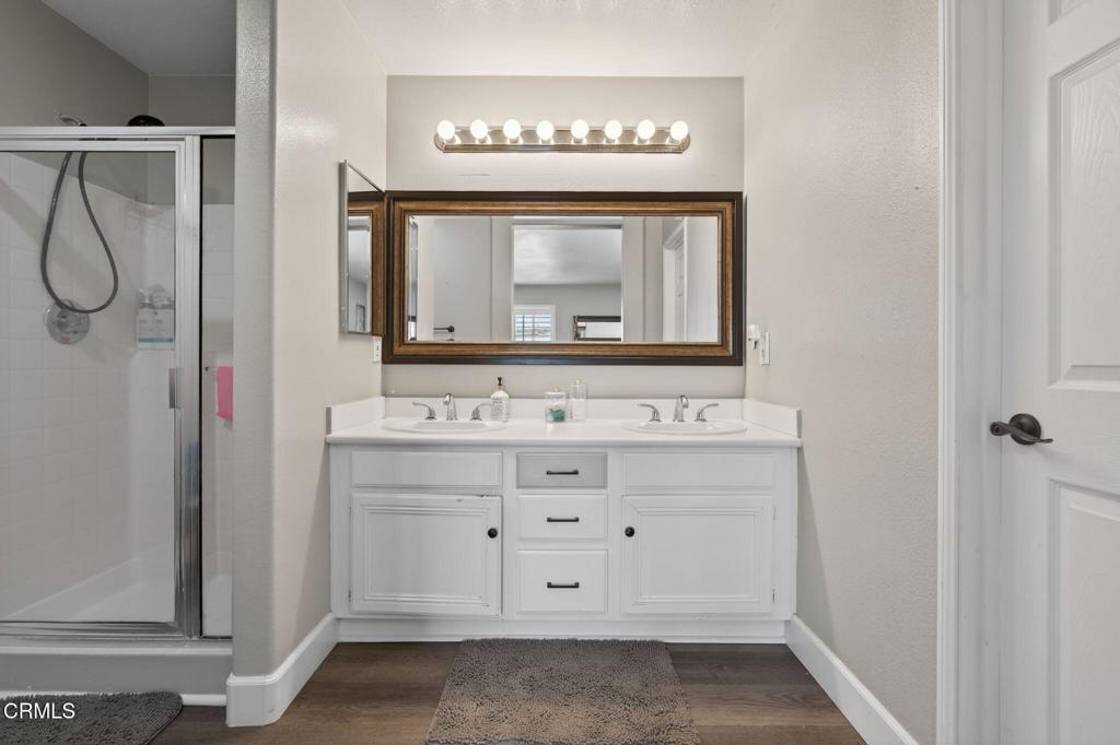 816 Noontide Way Oxnard, CA 93035 - Photo 20 of 41 a bathroom with a sink vanity and a mirror