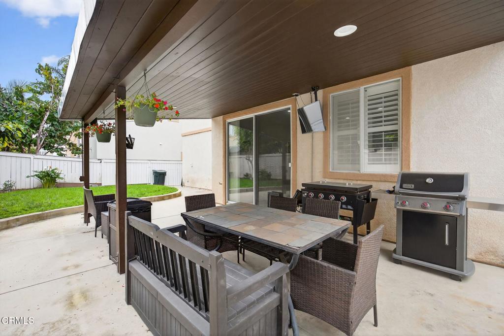 816 Noontide Way Oxnard, CA 93035 - Photo 31 of 41 a view of a patio with a table and chairs