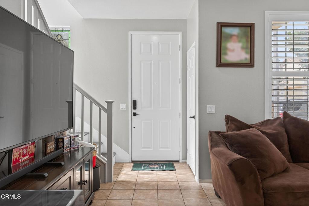 816 Noontide Way Oxnard, CA 93035 - Photo 6 of 41 a living room with furniture and a flat screen tv