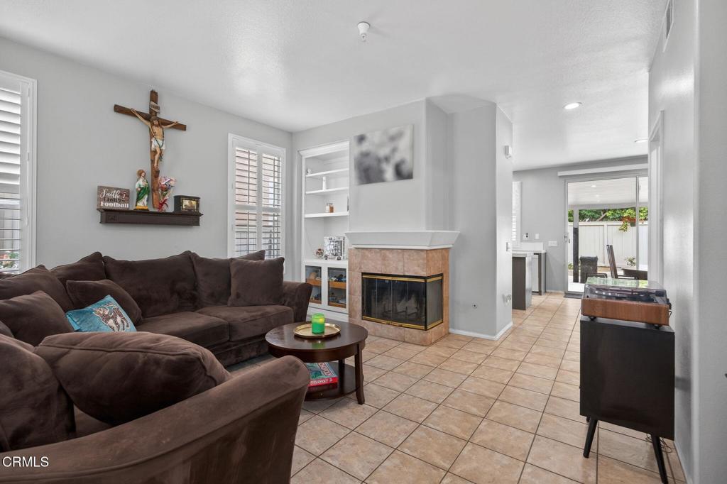 816 Noontide Way Oxnard, CA 93035 - Photo 7 of 41 a living room with furniture and a fireplace