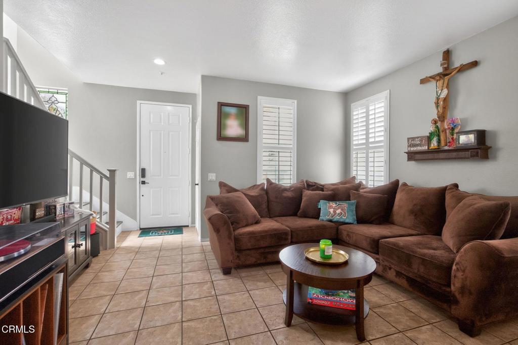 816 Noontide Way Oxnard, CA 93035 - Photo 8 of 41 a living room with furniture and a flat screen tv