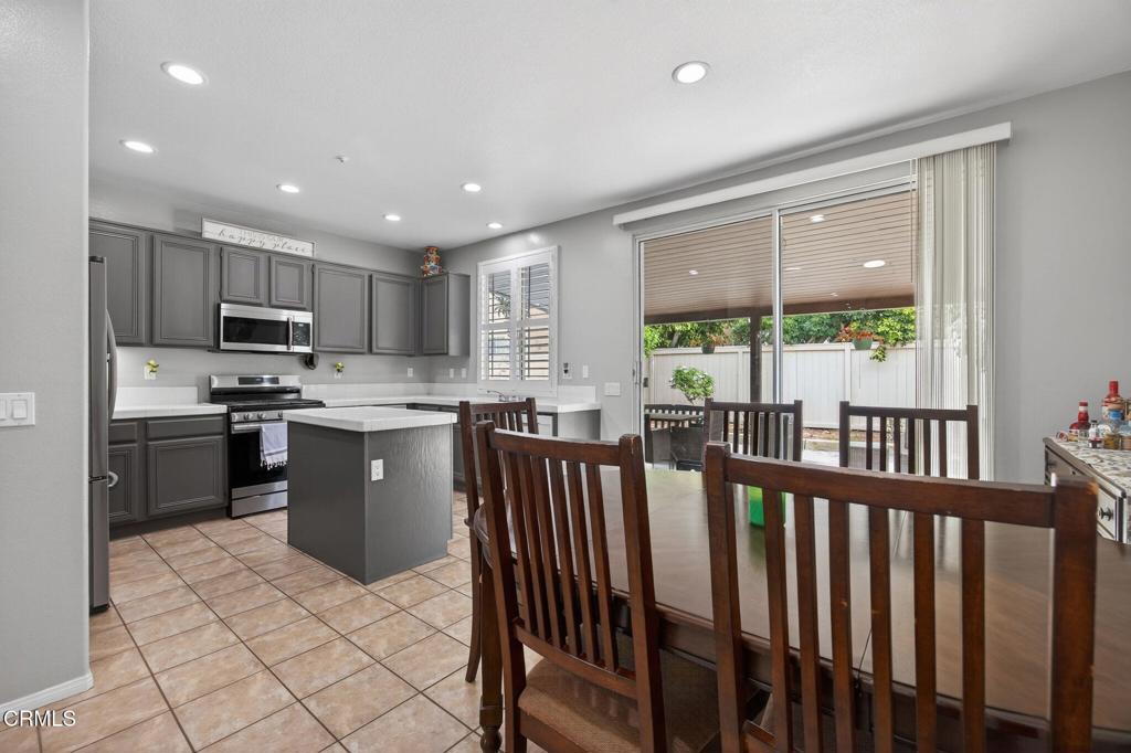 816 Noontide Way Oxnard, CA 93035 - Photo 10 of 41 a kitchen with stainless steel appliances granite countertop a refrigerator a sink dishwasher a stove and a refrigerator with wooden floor