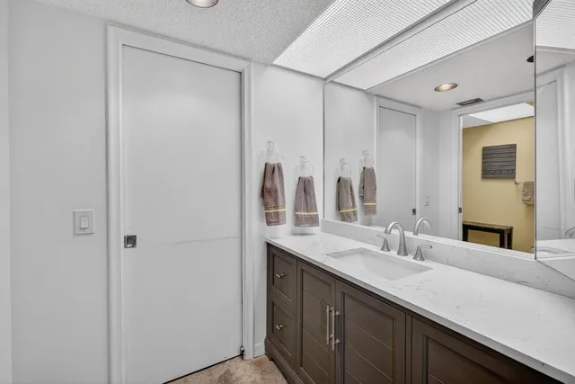 a bathroom with a double vanity sink mirror and double