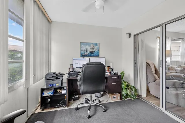 a workspace with furniture and a window