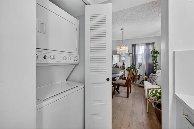 a view of a hallway with workspace and a window