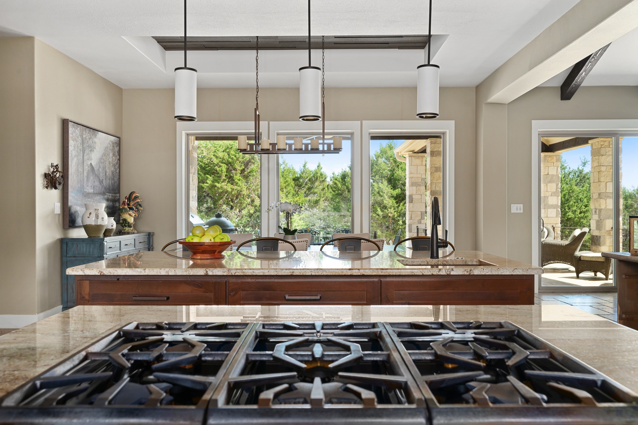 1001 La Cantera Leander, TX 78641 - Photo 15 of 40 a kitchen with kitchen island a large stove a sink and a granite counter tops