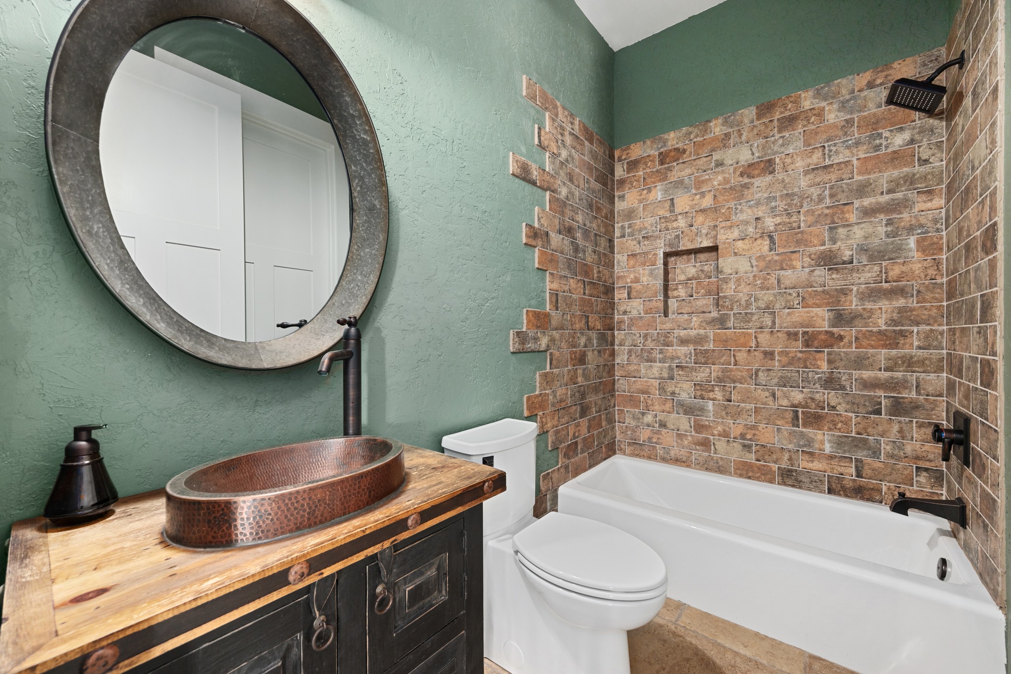 1001 La Cantera Leander, TX 78641 - Photo 21 of 40 a bathroom with a sink a toilet and a mirror