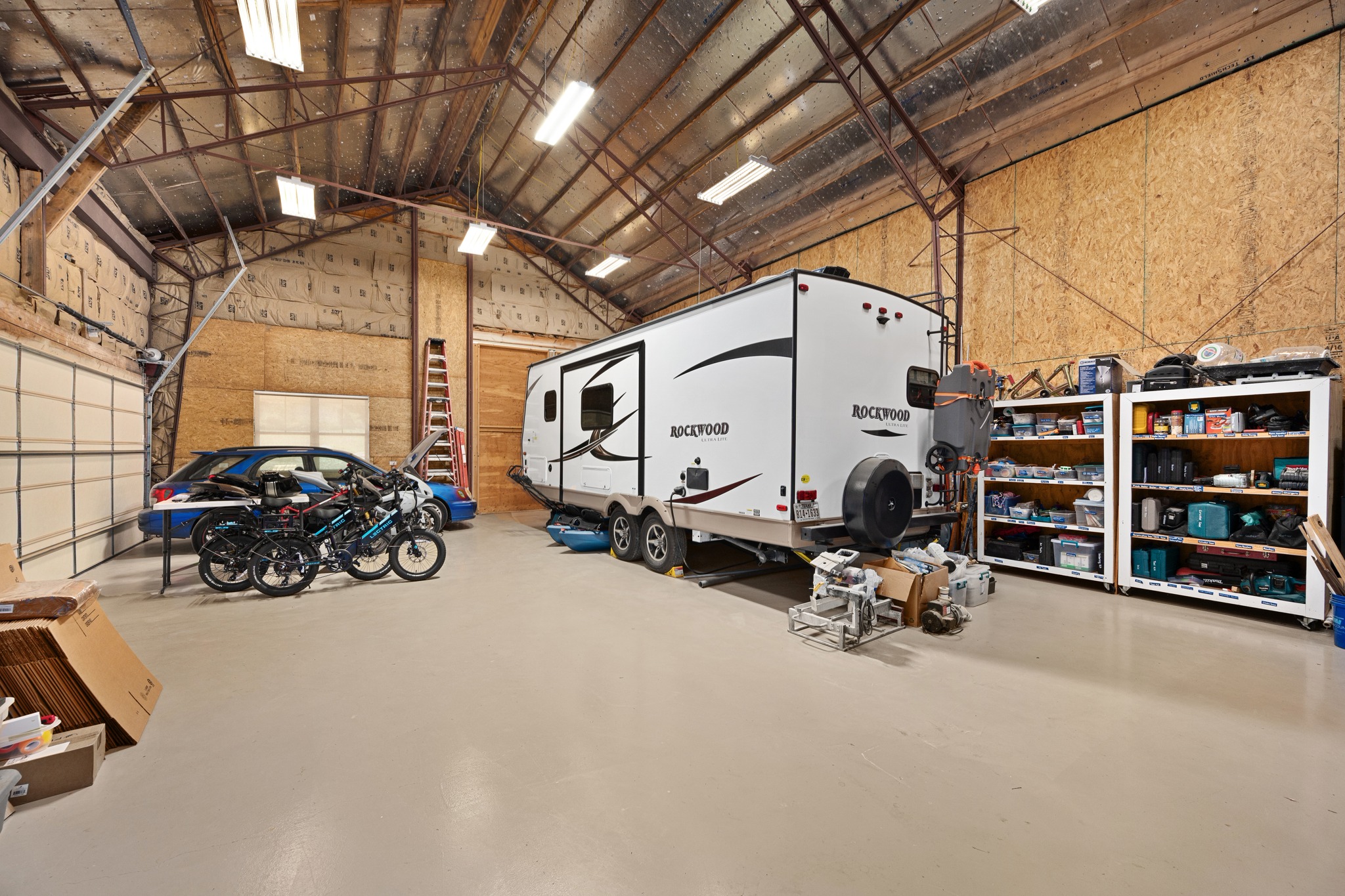 1001 La Cantera Leander, TX 78641 - Photo 35 of 40 a view of a garage with parked cars