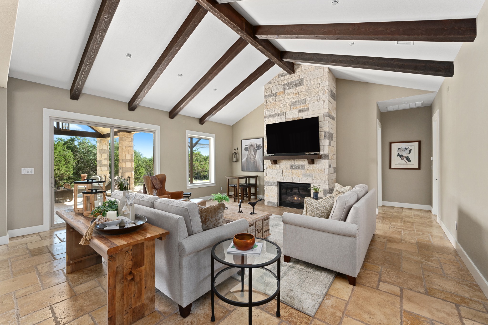 1001 La Cantera Leander, TX 78641 - Photo 5 of 40 a living room with furniture a fireplace and a flat screen tv