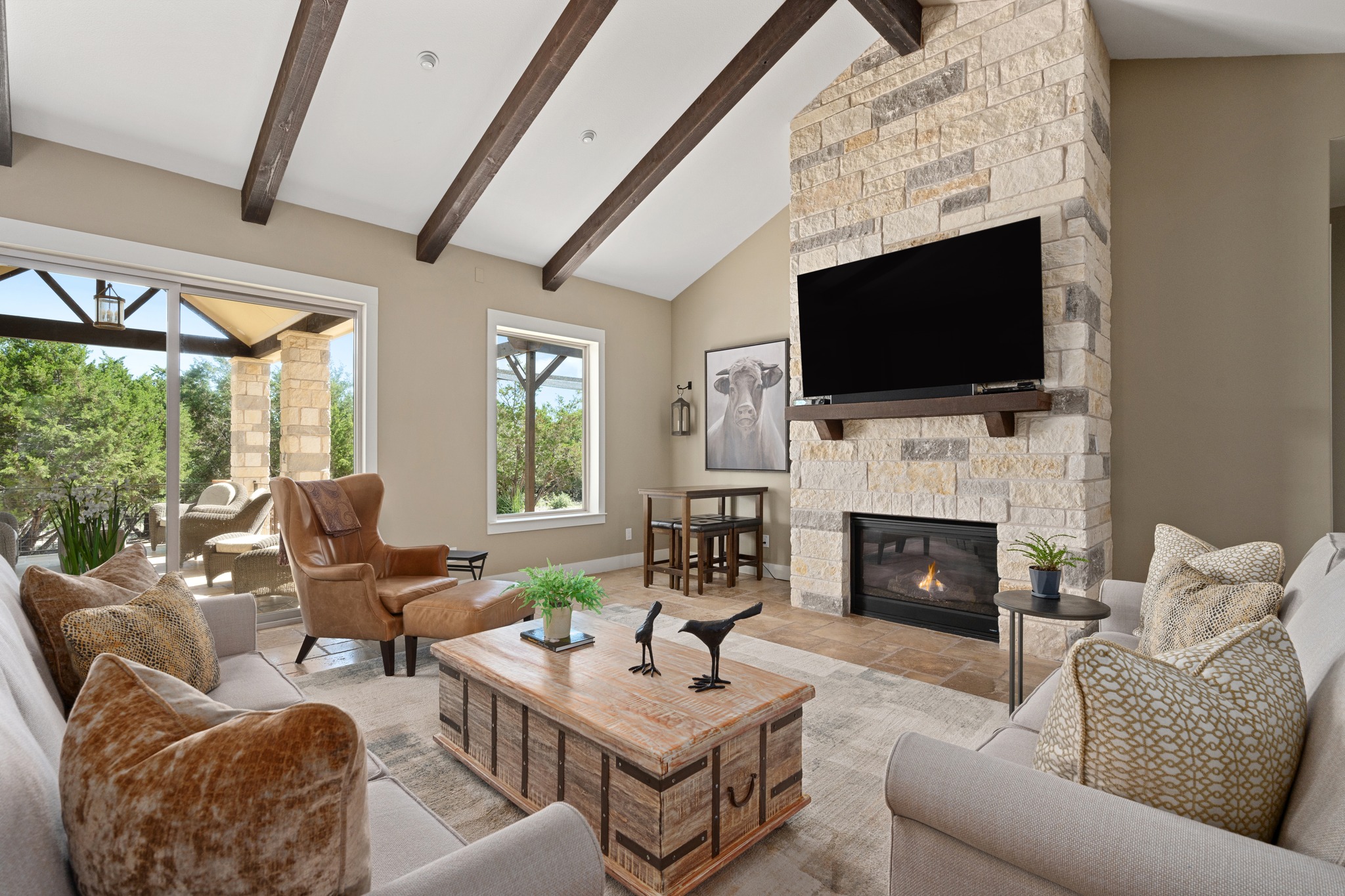 1001 La Cantera Leander, TX 78641 - Photo 6 of 40 a living room with furniture a flat screen tv and a fireplace