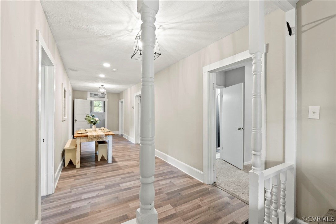 2510 Broad St Road Gum Spring, VA 23065 - Photo 16 of 44 a view of a hallway with wooden floor table and chairs