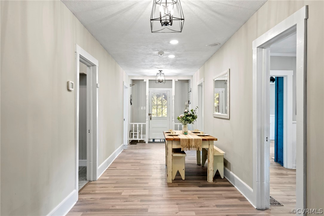 2510 Broad St Road Gum Spring, VA 23065 - Photo 17 of 44 a view of a hallway with wooden floor windows and a livingroom