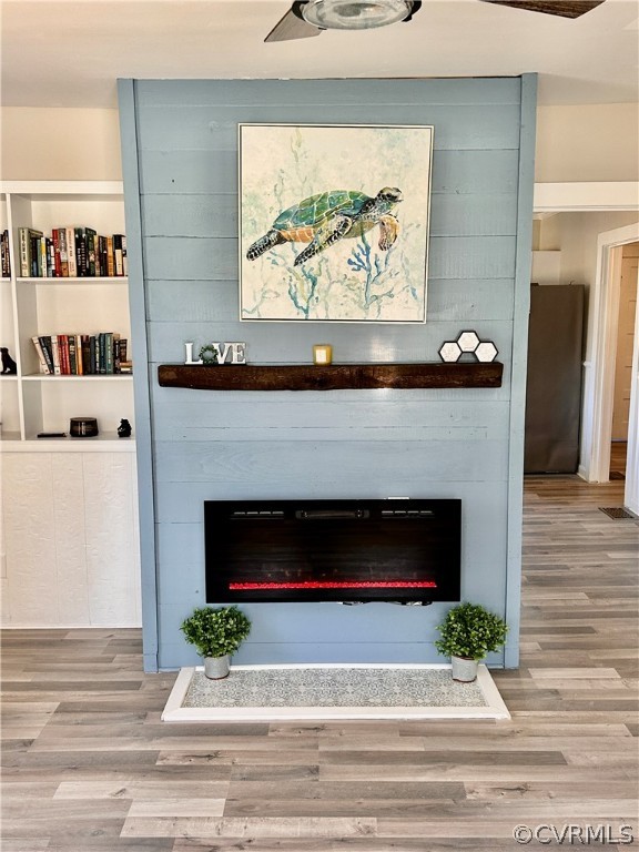 2510 Broad St Road Gum Spring, VA 23065 - Photo 20 of 44 a living room with a fireplace and a floor to ceiling window