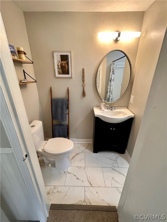 2510 Broad St Road Gum Spring, VA 23065 - Photo 25 of 44 a bathroom with a toilet a sink and mirror