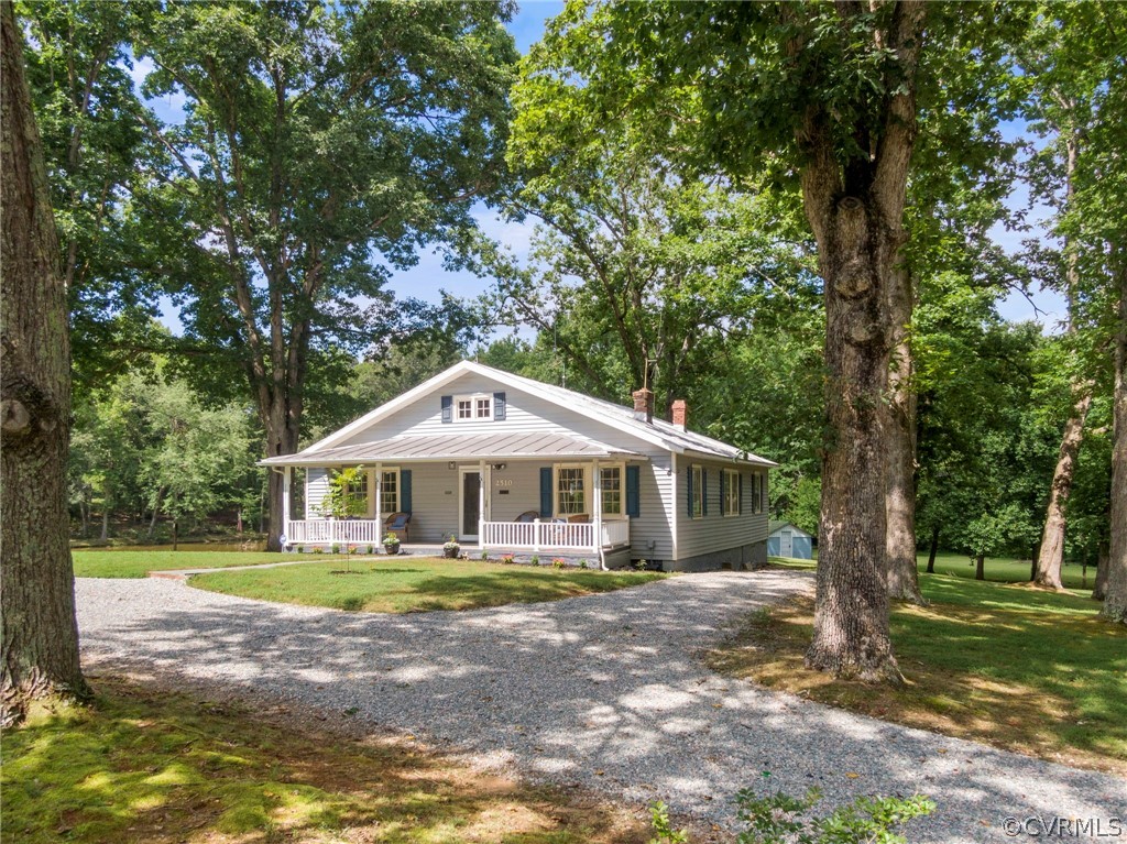 2510 Broad St Road Gum Spring, VA 23065 - Photo 5 of 44 a front view of a house with garden