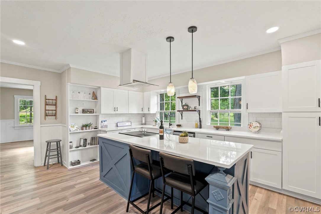 2510 Broad St Road Gum Spring, VA 23065 - Photo 9 of 44 a kitchen with a sink stove and white cabinets with wooden floor