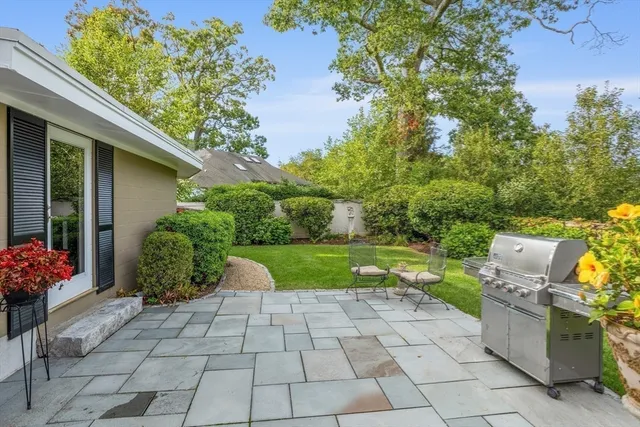 a view of a backyard with sitting area