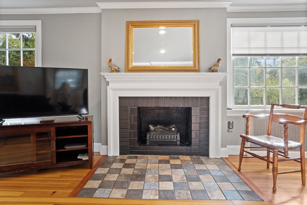 36 Adams Street Lexington, MA 02420 - Photo 8 of 24 a living room with furniture and a fireplace