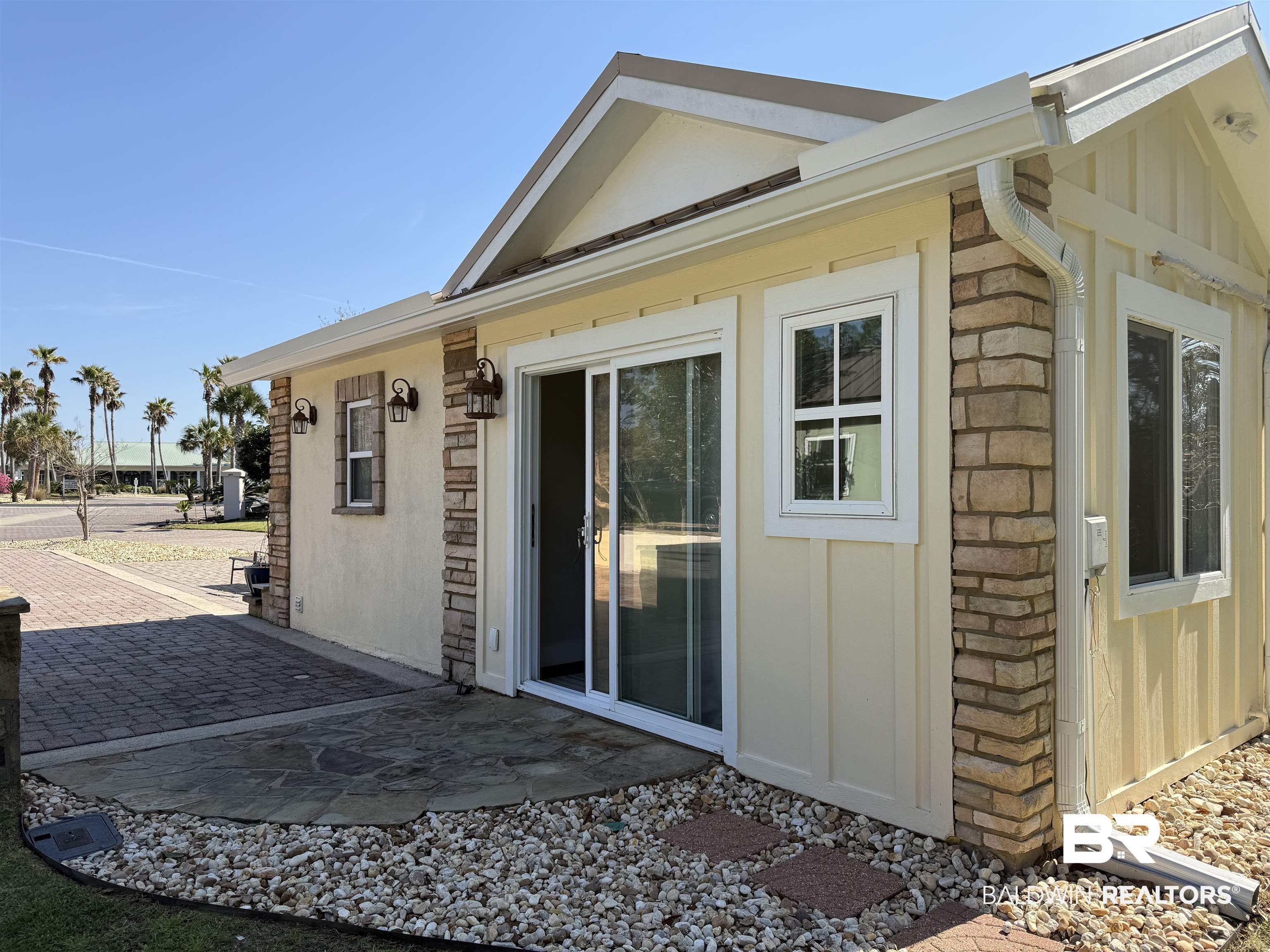 28114 Preserve Trail, Unit 190 Elberta, AL 36530 - Photo 5 of 69 View of property exterior featuring stone siding and board and batten siding