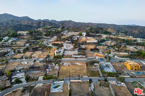 an aerial view of residential houses and outdoor space