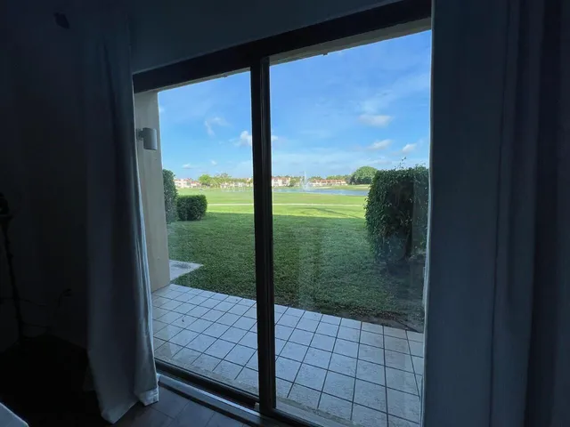 a view of a glass door and the window