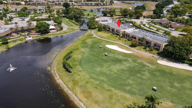 an aerial view of a house with a swimming pool