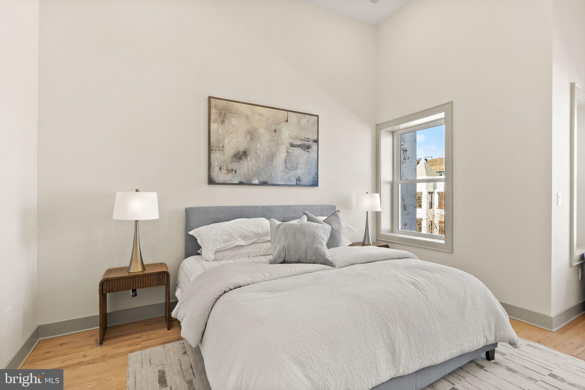 52 S Street Northwest Washington, DC 20001 - Photo 13 of 30 a bedroom with a bed and a lamp on table