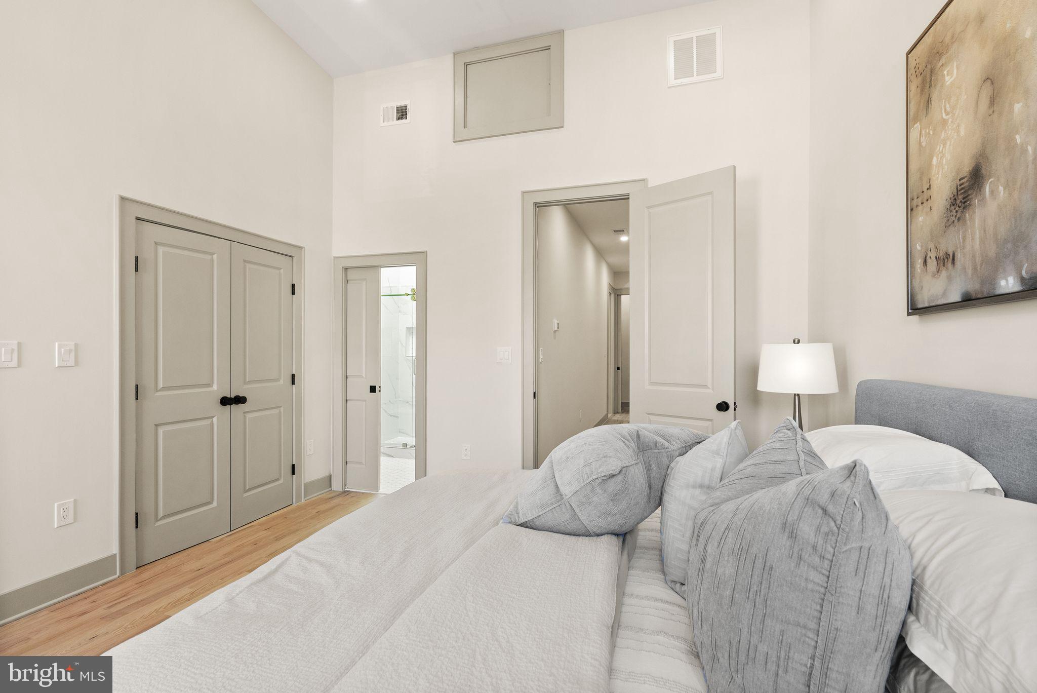 52 S Street Northwest Washington, DC 20001 - Photo 14 of 30 a bedroom with a bed and a mirror