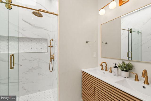 a bathroom with a sink and shower
