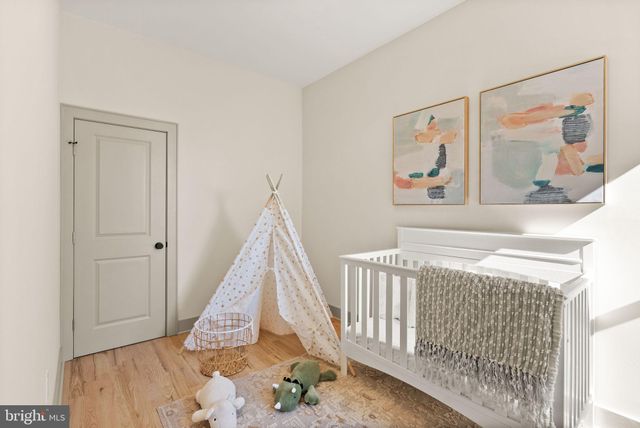 a view of a bedroom with baby crib