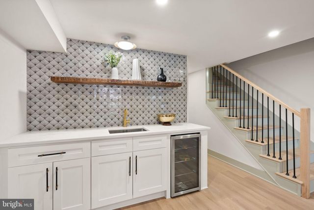 a kitchen with a sink and cabinets