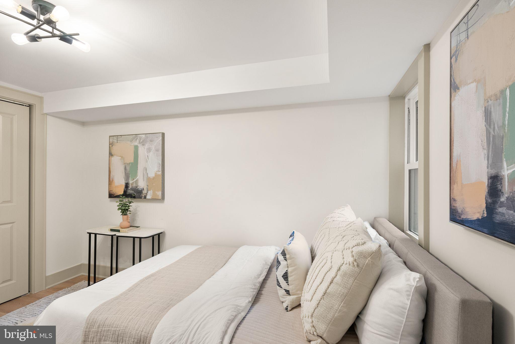 52 S Street Northwest Washington, DC 20001 - Photo 26 of 30 a bedroom with a bed and a window