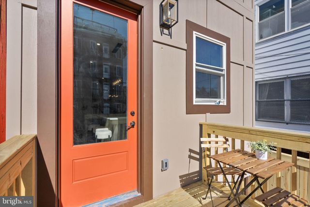 a view of a door and chair in the balcony