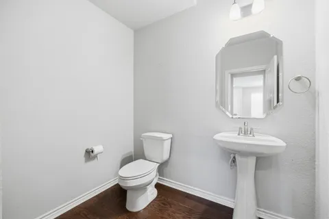 a bathroom with a double vanity sink a mirror and a shower