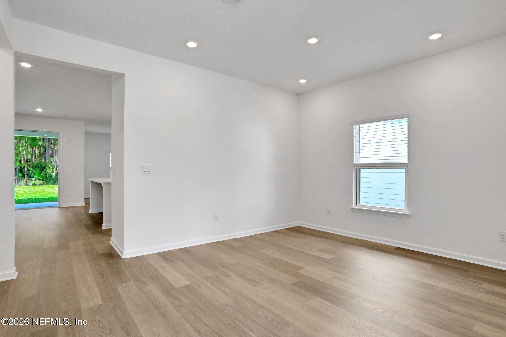 3154 Gadwall Road Orange Park, FL 32065 - Photo 7 of 10 wooden floor in an empty room with a window