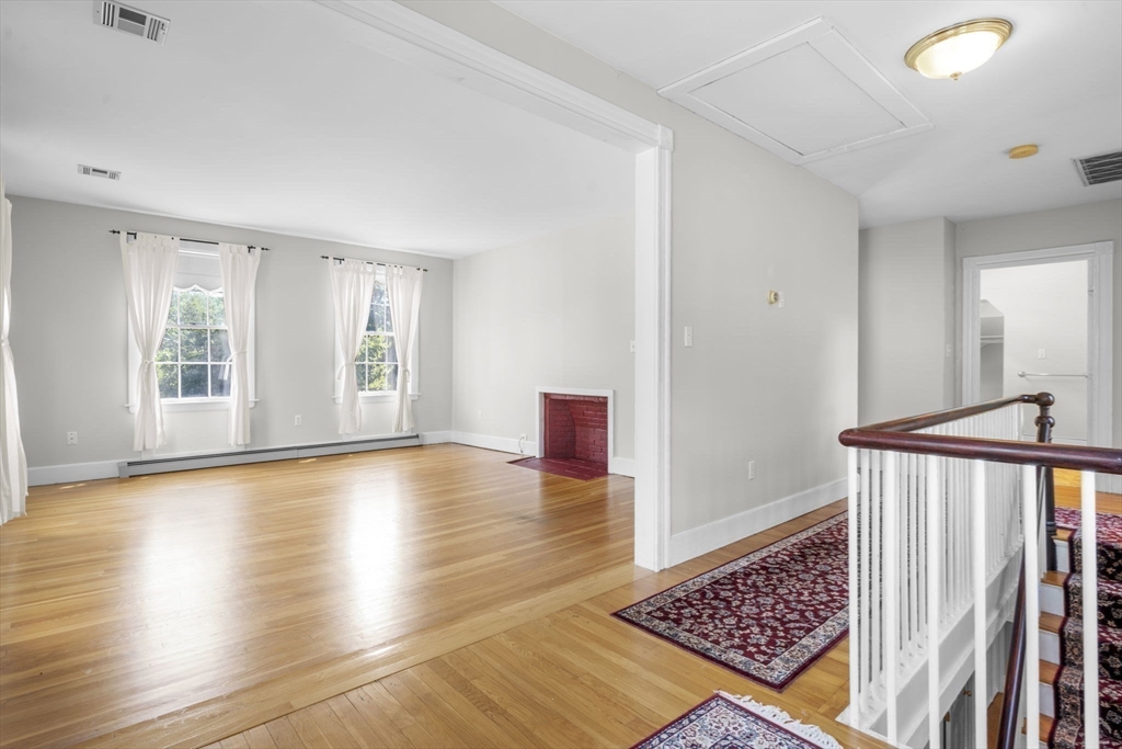 33 Concord Road Billerica, MA 01821 - Photo 25 of 42 a view of an empty room with wooden floor and a window