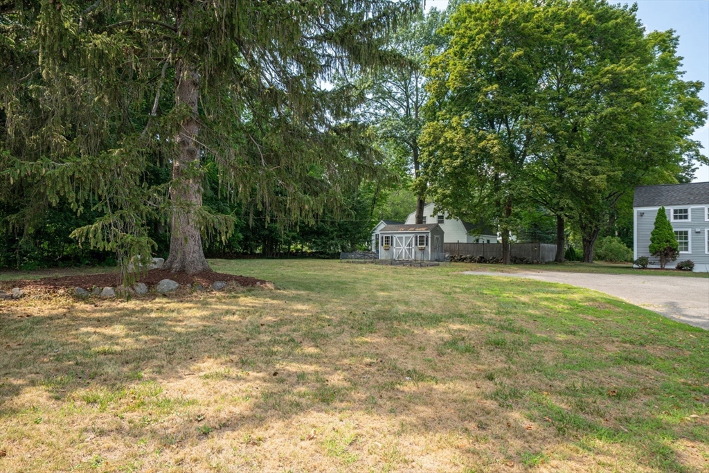 33 Concord Road Billerica, MA 01821 - Photo 40 of 42 a house with trees in the background