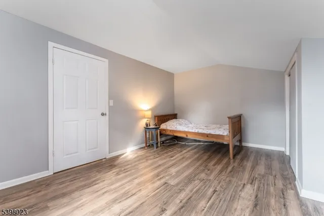 a view of a livingroom with furniture and wooden floor