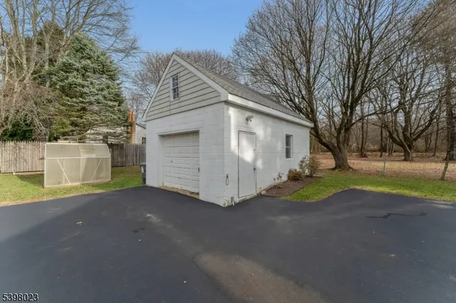 a view of a house with a yard and garage