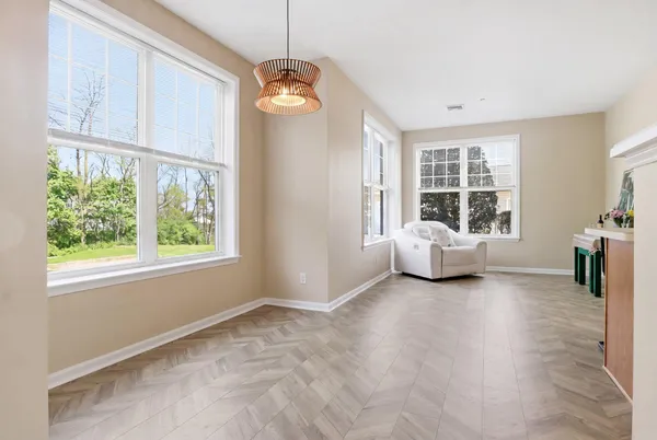 a view of a livingroom with a window and furniture