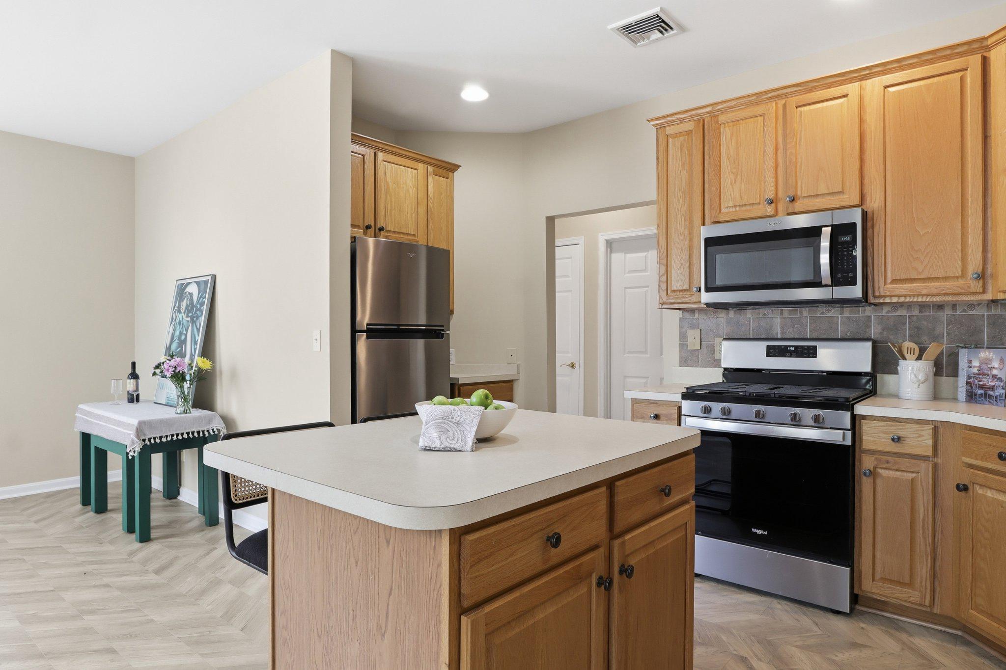 1010 Crest Way, Unit 103 York, PA 17403 - Photo 16 of 49 a kitchen with a stove a sink and a refrigerator