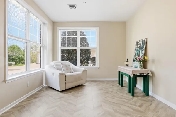 a living room with furniture and windows