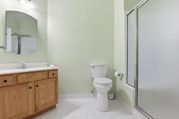 a bathroom with a toilet sink and a mirror