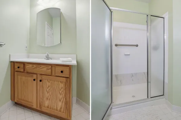 a bathroom with a shower sink and mirror