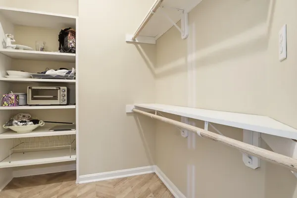 a view of storage and utility room with racks on the wall