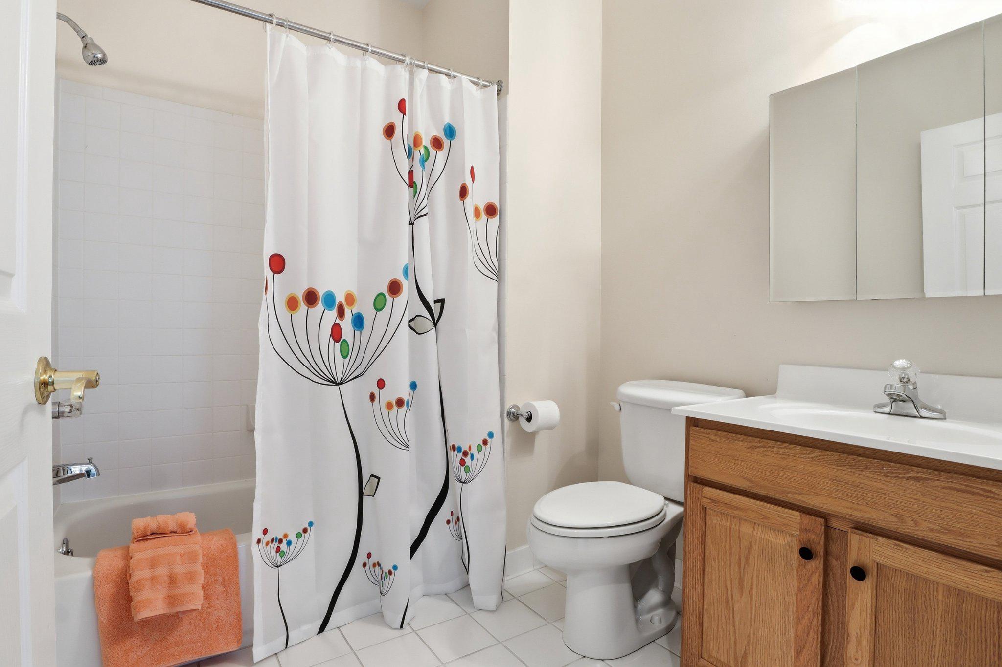 1010 Crest Way, Unit 103 York, PA 17403 - Photo 29 of 49 a bathroom with a sink a toilet and a shower curtain